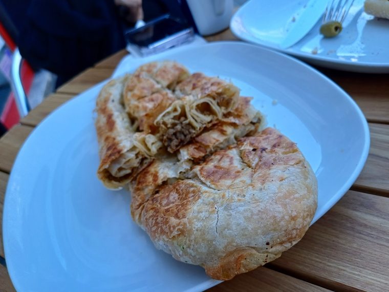 A toasted cheese panini on a blue plate